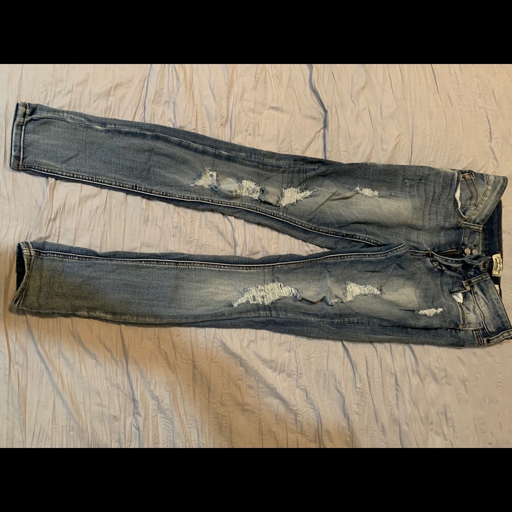 Distressed medium wash skinny jeans